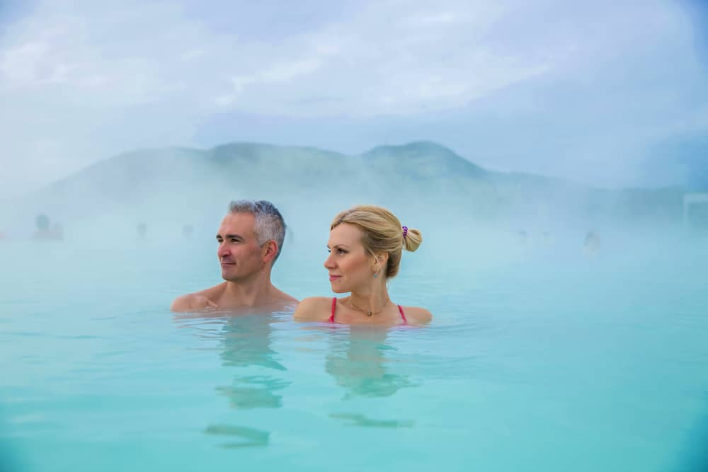 A couple enjoying a relaxing soak at one of the top hot springs in Montana near our Missoula Bed and Breakfast